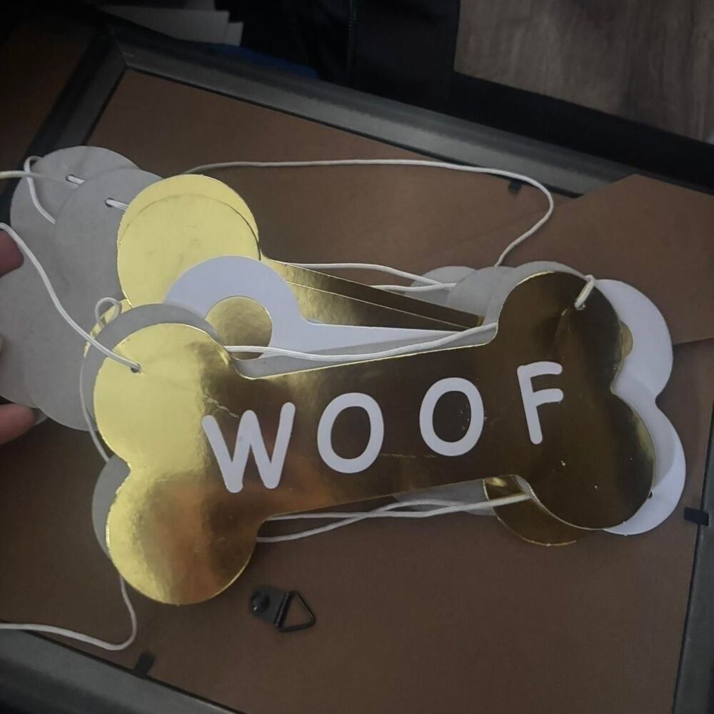 2 gold & white dog bone garlands (they say woof & have gold & white polka dots)